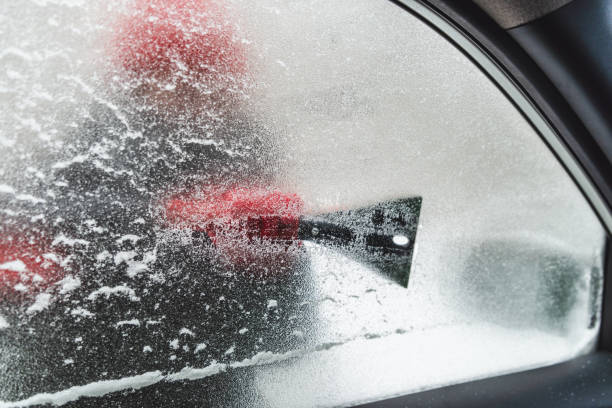 istock iced window from inside car cleaning snow storm 1185577358