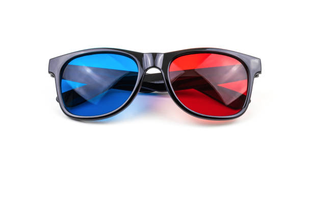 istock 3D plastic glasses isolated on white / anaglyph glasses lie on rims with folded ears 1185579320