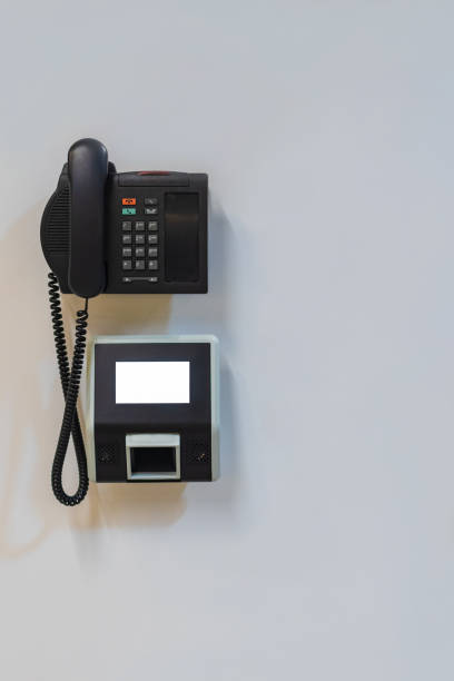 istock Stationary barcode scanner with mockup and telephone on the wall with copy space. 1185579415