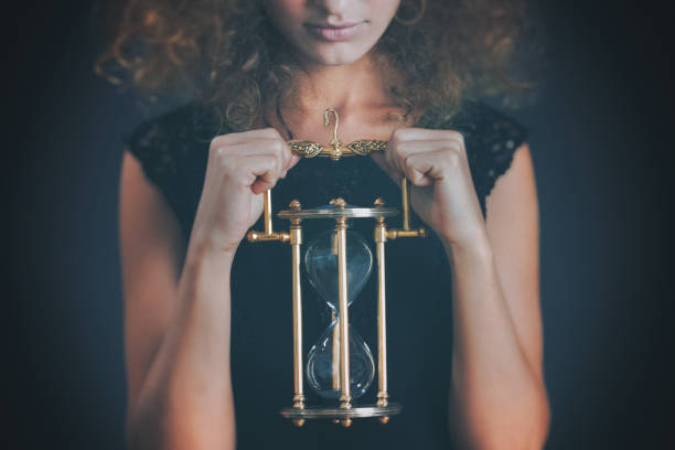 istock Woman holding a hourglass 1185582794