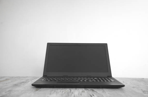 istock Black laptop on the office desk. Technology concept 1185583839