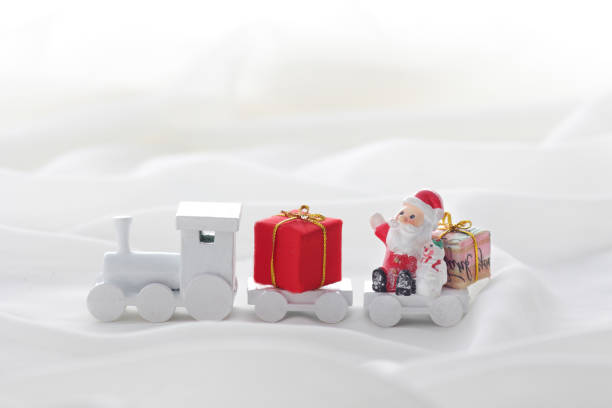 istock Santa Claus comes with a present on the train 1185585734
