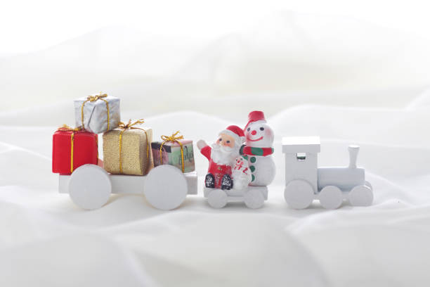 istock Santa Claus comes with a present on the train 1185585742