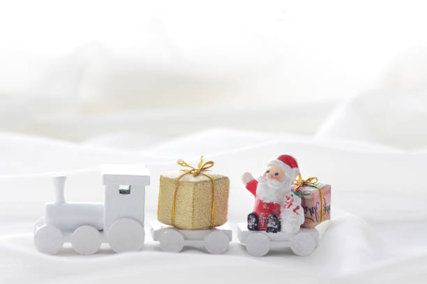 istock Santa Claus comes with a present on the train 1185585743