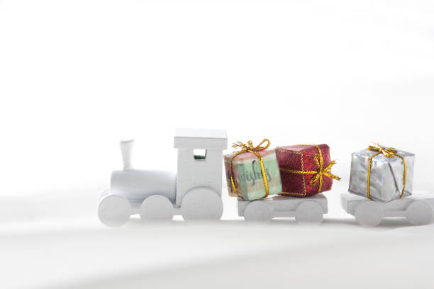 istock Santa Claus comes with a present on the train 1185585745