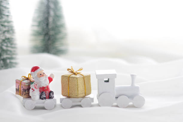 istock Santa Claus comes with a present on the train 1185585748