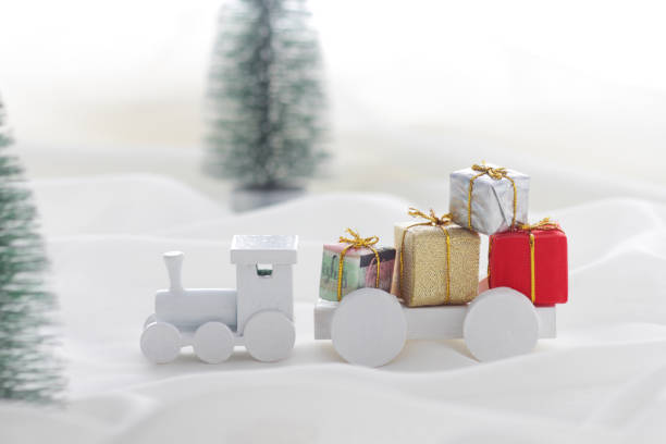istock Santa Claus comes with a present on the train 1185585754