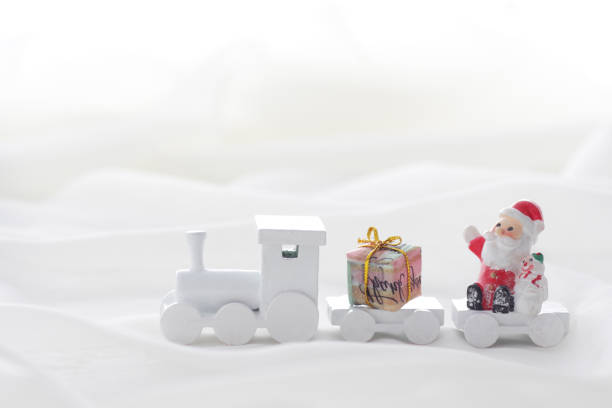 istock Santa Claus comes with a present on the train 1185585756