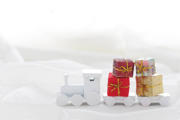 istock Santa Claus comes with a present on the train 1185585761