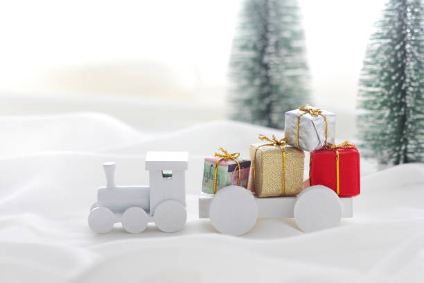 istock Santa Claus comes with a present on the train 1185585765