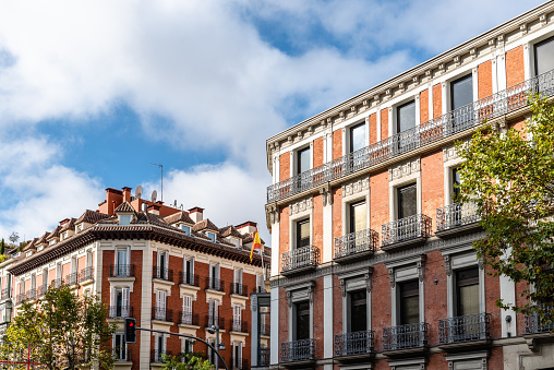 Old luxury residential buildings with balconies in Serrano Street in Salamanca district in Madrid.