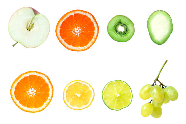 Isolated fruits halves. Cut lemon, lime, orange, grapefruit, apple, avocado, kiwi and grapes isolated on white background