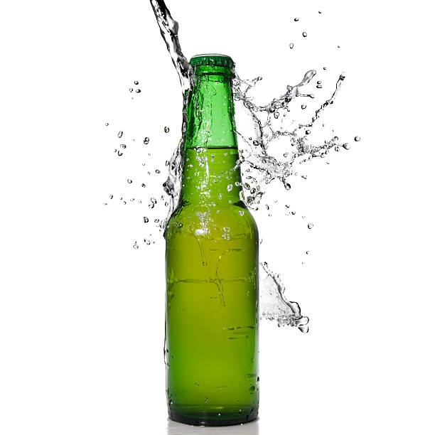 istock Bottle of beer with water splash 118559096