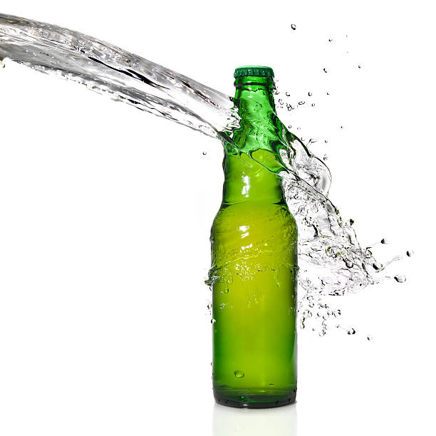 istock Bottle of beer with water splash 118559112