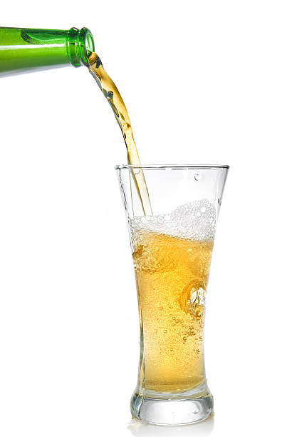 istock Beer pouring from bottle into glass 118559128
