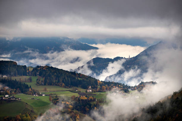 istock Village in fog 1185592155
