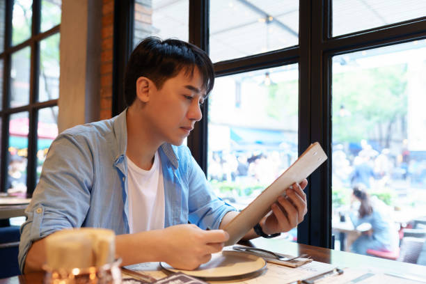 istock asian man orders at the restaurant 1185593878