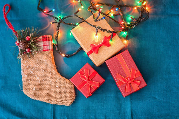 Christmas decoration arrangement, led lights, santa boot shaped gift bag and giftboxes
