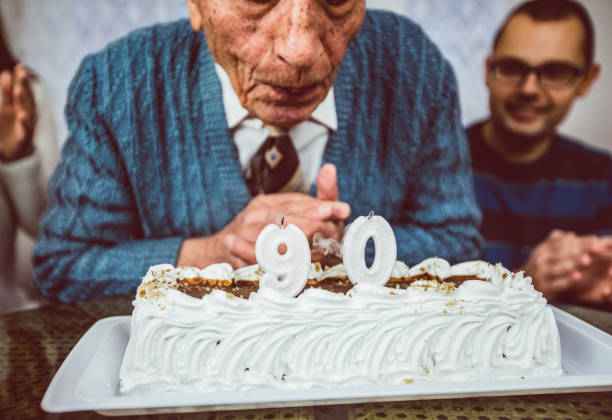 istock Senior man celebrates birthday 1185595113