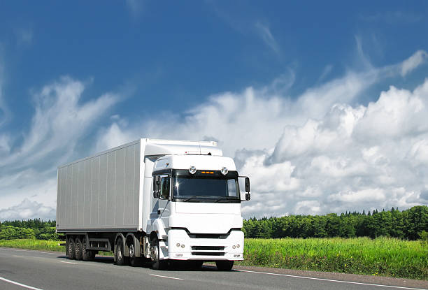 istock white truck on country highway under blue sky 118559891
