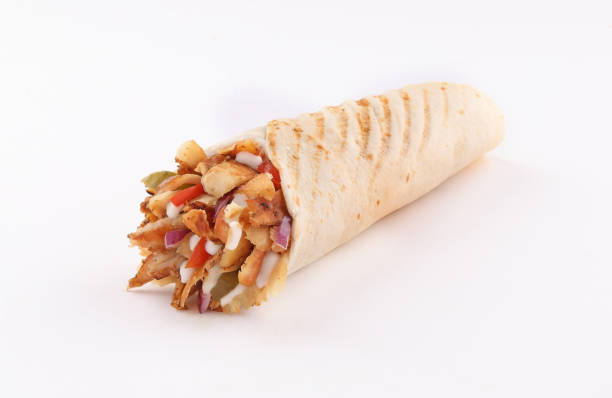 shawarma wrap with onion and sauce on white background shawerma, shawarma tortilla wrap with onion, tomato, lettuce and garlic sauce on white background shawarma stock pictures, royalty-free photos & images