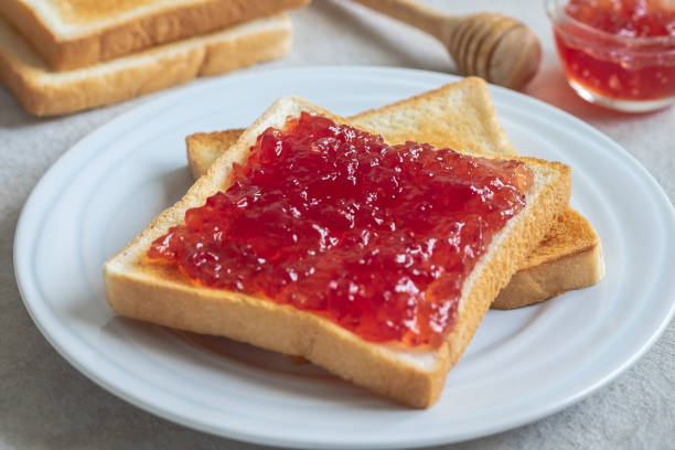 Toast bread with strawberry jam on plate