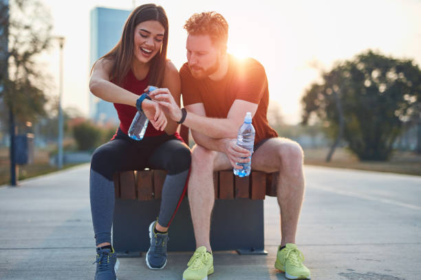 istock Modern couple making pause in an urban park during jogging / exercise. 1185605285