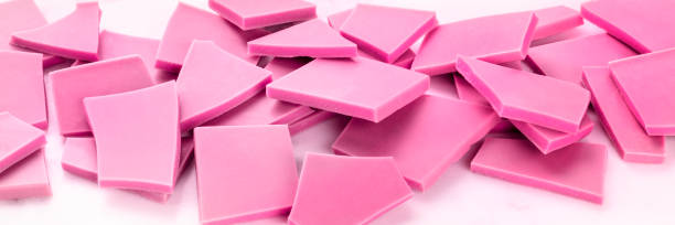 istock A panorama of ruby chocolate slices, broken on a white marble cooking table 1185607026