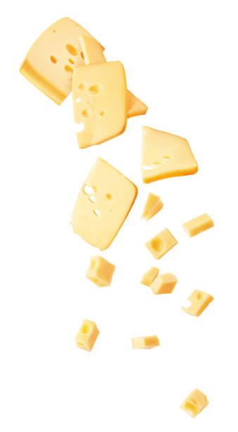 Hard cheese cut into strips and cubes isolated on a white background