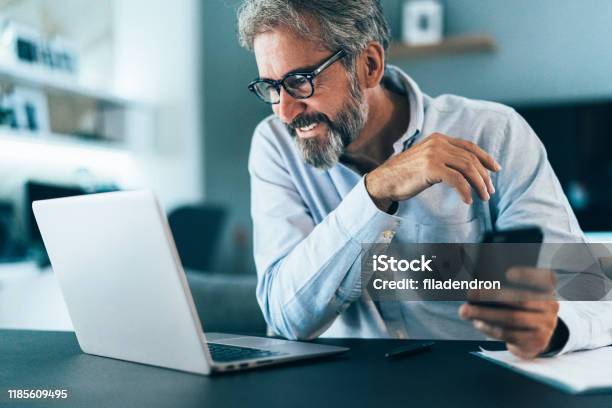 Working At Home Stock Photo - Download Image Now - Laptop, Senior Adult, Men