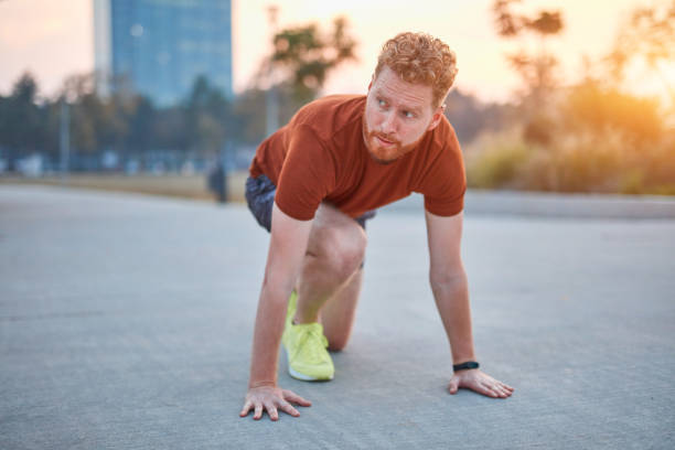 istock Young modern man jogging / exercising in an urban park. 1185609914