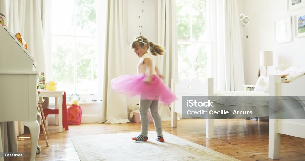 I'm the princess and this is my castle Shot of an adorable little girl at home Girls Stock Photo