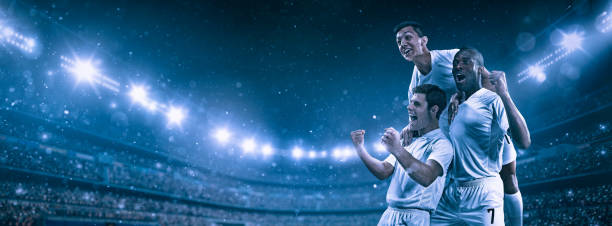 Soccer player celebrating victory on a professional arena full of spectators