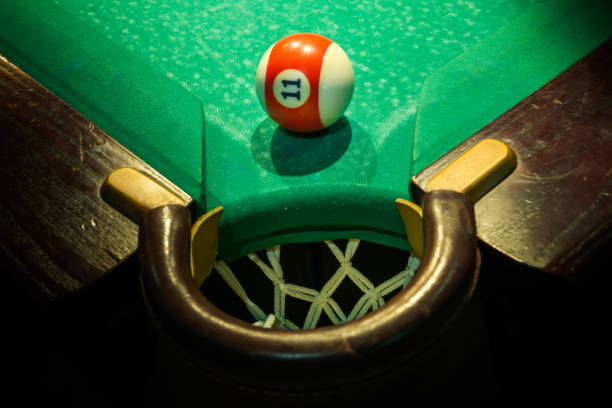 Billiard ball is ready to fall into pocket