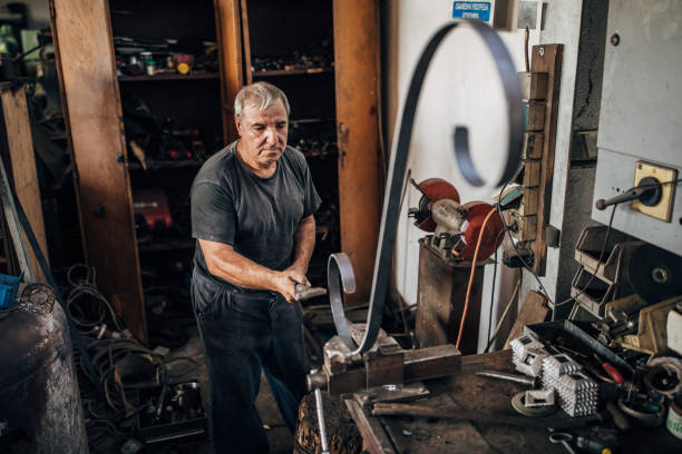 istock Mature man working in factory workshop 1185614390