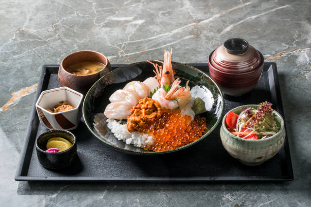 Set Fresh Mix Raw Seafood Kaisen Don (Sashimi seafood Rice Bowl) served with sushi and salmon rolls , Japanese food. rice bowl restaurant stock pictures, royalty-free photos & images
