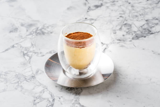 istock lassic tiramisu in a glass on a white background 1185615831