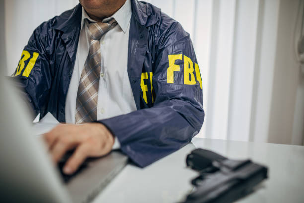 istock An FBI agent uses a laptop 1185615944