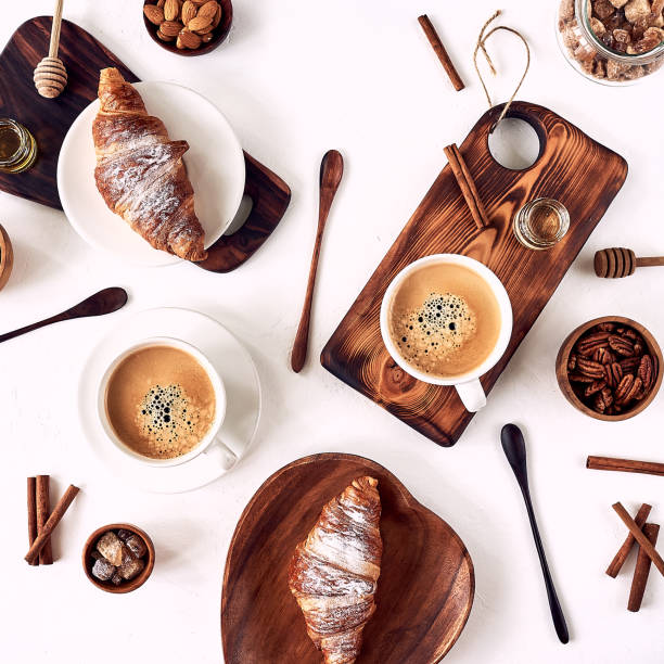 istock breakfast pattern, croissant, coffee, honey, cinnamon sticks, nuts, sugar. Good morning concept. 1185616576