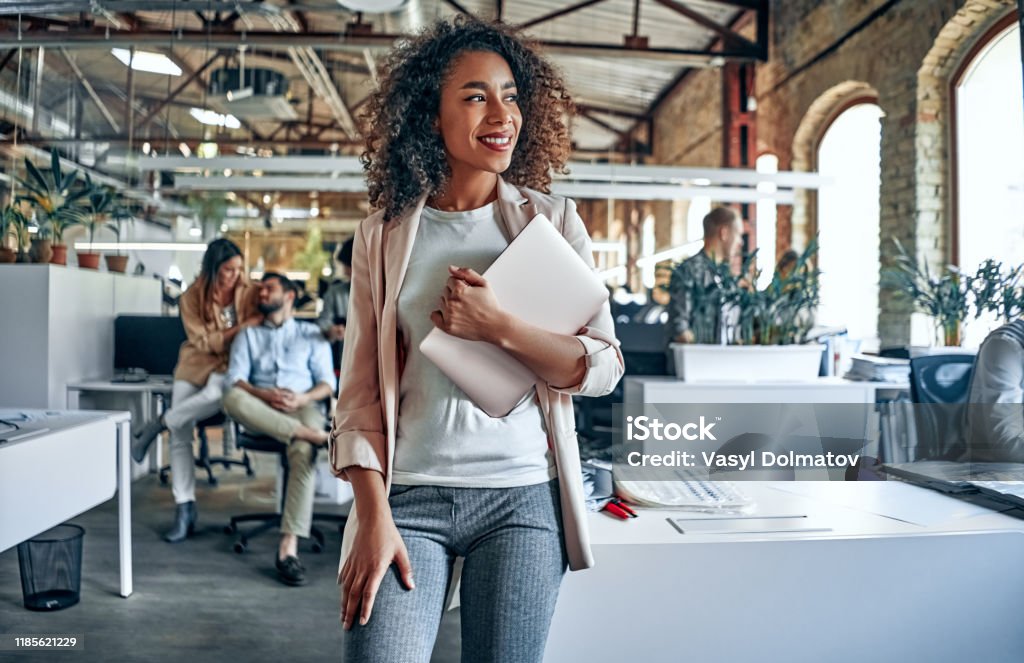 Young business people in office Group of young multiracial business people are working in modern office. Freelancers in coworking place. Creative and stylish youth. Office Stock Photo