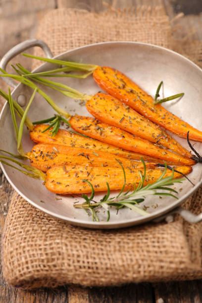 istock fried carrot in cooking pan 1185621439