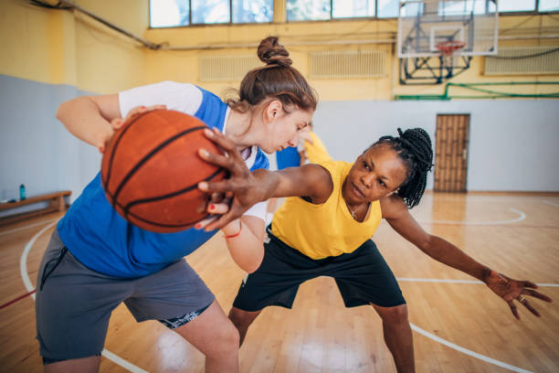 istock Two women in basketball duel 1185621464