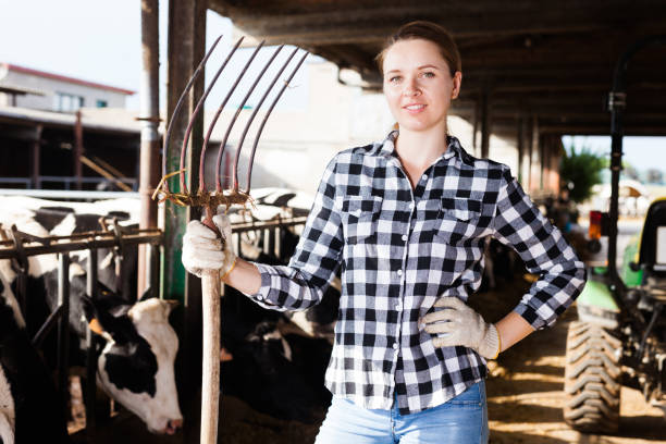 istock Female farmer on dairy farm 1185622202