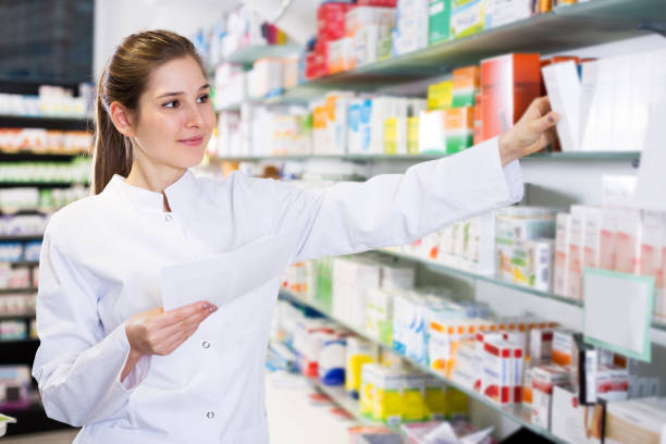 istock Woman pharmacist working in pharmacy 1185622252