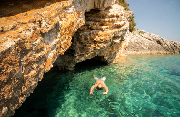 istock Man sunbathing and relaxing at the sea 1185622519