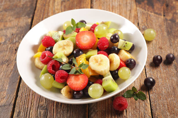 istock fresh fruit salad in bowl 1185622587
