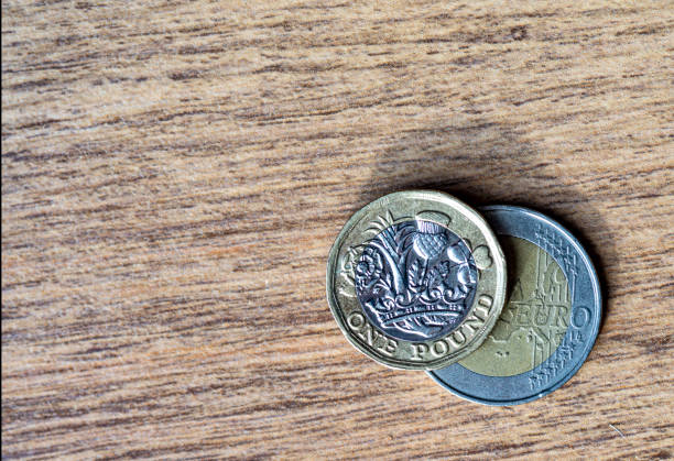 istock One pound and Two Euro coins 1185623033