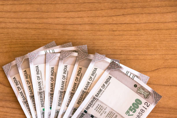 istock New series Indian five hundred rupee notes on wooden table background with copy space. 1185624457