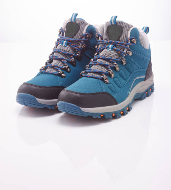 istock hiking boots modern blue color in the white background 1185624465
