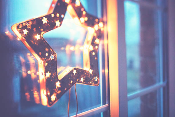 Christmas Window Holiday Home Lights, Room Decorated By Xmas Tree Candles Presents Gift, New Year Night, Snow And Frost